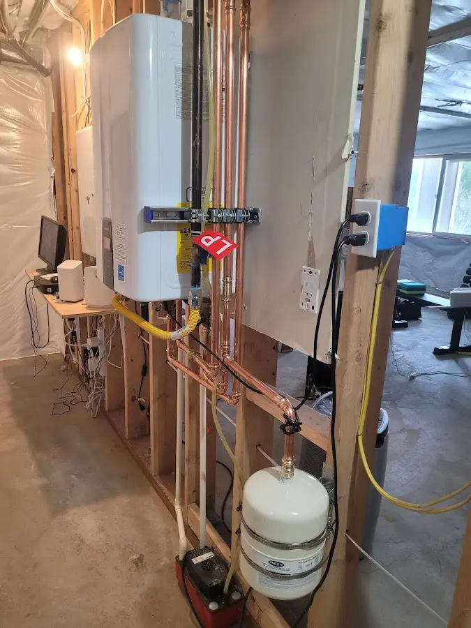 Licensed plumber repairing a kitchen sink in Hancock